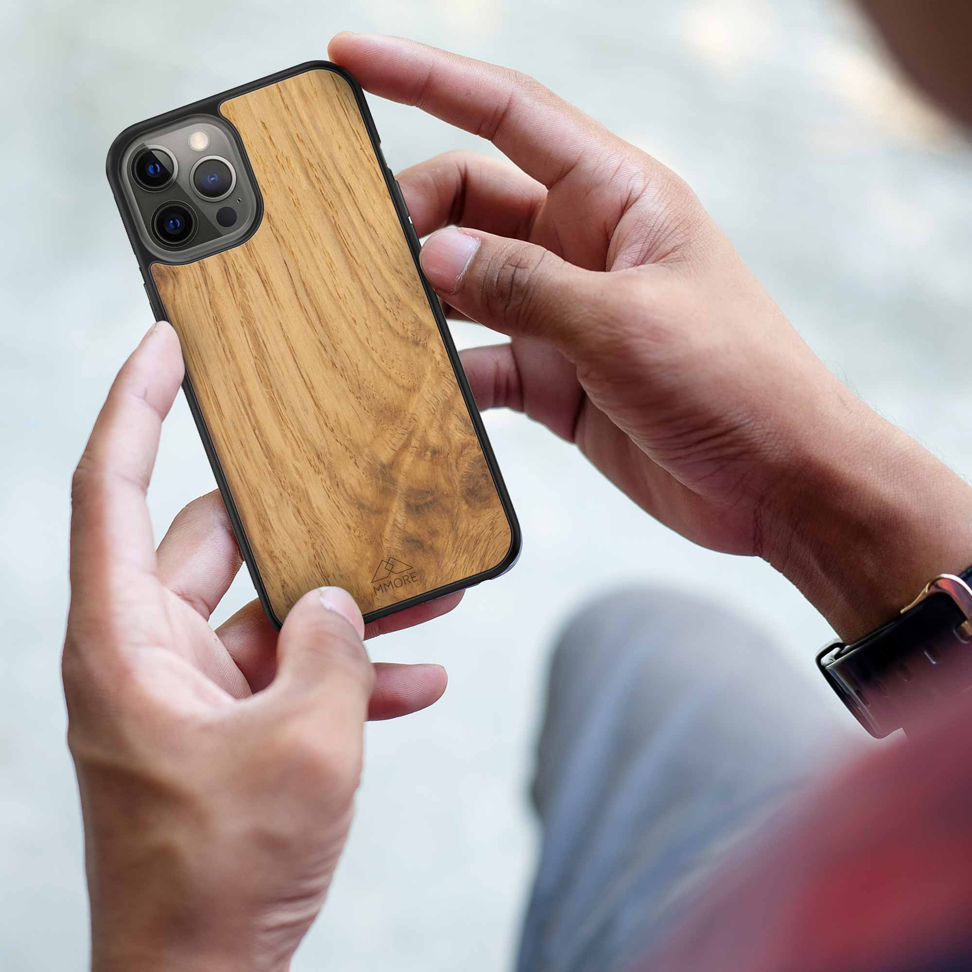 iPhone 12 Oak Wood Phone case held in hand